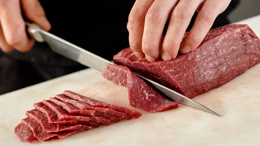 santoku knife cutting meat